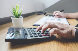 Businessman working on a graph document financial report and ana